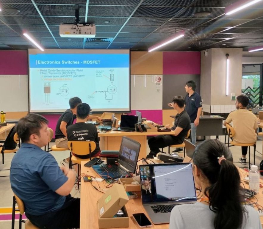 Teams at a hands-on electronics prototyping workshop